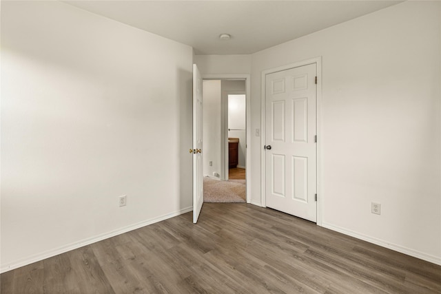 603 Luella Ln, Missoula, MT 59801 - unfurnished bedroom featuring wood finished floors and baseboards