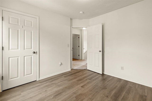 603 Luella Ln, Missoula, MT 59801 - unfurnished bedroom featuring wood finished floors and baseboards