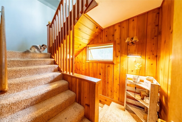 38534 US Highway 2, Libby, MT 59923 - staircase featuring vaulted ceiling and wooden walls