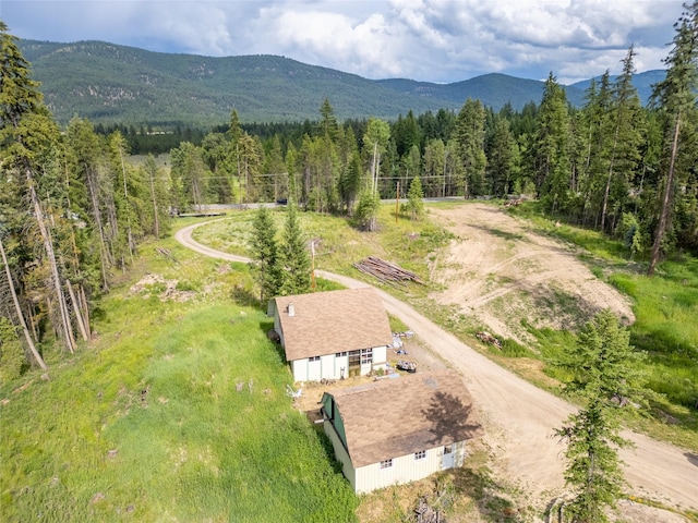 38534 US Highway 2, Libby, MT 59923 - aerial view of property and surrounding area with a forest and a mountain backdrop