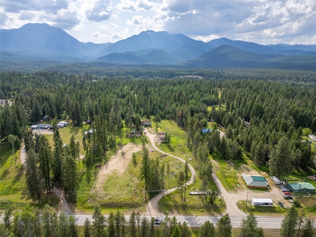 38534 US Highway 2, Libby, MT 59923 - aerial view of property and surrounding area featuring a heavily wooded area