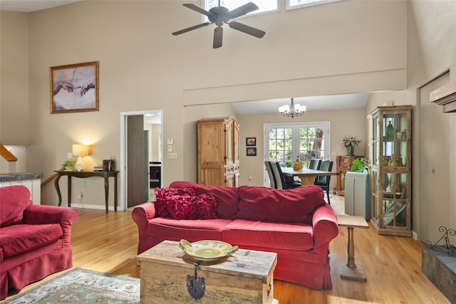 4280 Fox Farm Rd, Missoula, MT 59802 - living room with light wood-style flooring, a ceiling fan, high vaulted ceiling, and a chandelier
