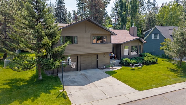 4280 Fox Farm Rd, Missoula, MT 59802 - tri-level home featuring a chimney, a garage, driveway, and a front yard