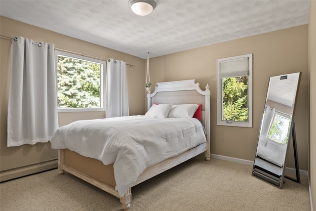 4280 Fox Farm Rd, Missoula, MT 59802 - carpeted bedroom featuring a baseboard radiator and a textured ceiling