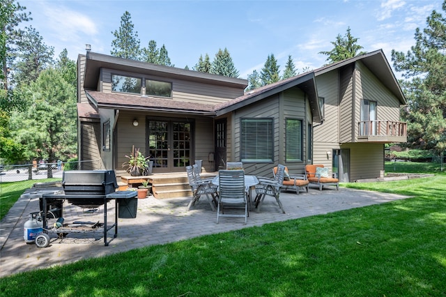 4280 Fox Farm Rd, Missoula, MT 59802 - back of property featuring a patio, a chimney, and outdoor lounge area