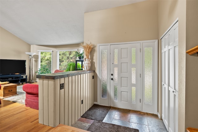 4280 Fox Farm Rd, Missoula, MT 59802 - entryway featuring lofted ceiling and stone tile floors
