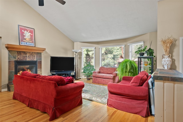 4280 Fox Farm Rd, Missoula, MT 59802 - living area with wood finished floors, a tile fireplace, ceiling fan, and lofted ceiling