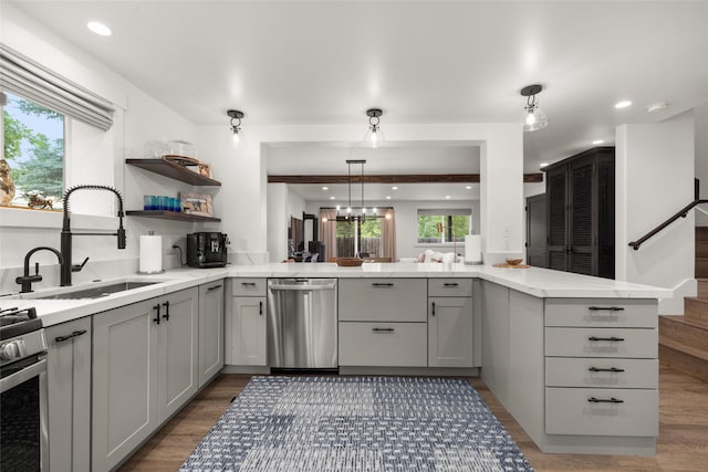 441 Karrow Ave, Whitefish, MT 59937 - kitchen featuring appliances with stainless steel finishes, gray cabinetry, wood finished floors, decorative light fixtures, and recessed lighting