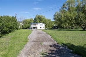 3265 US Highway 2 W, Kalispell, MT 59901 - view of front facade with a front yard and asphalt driveway