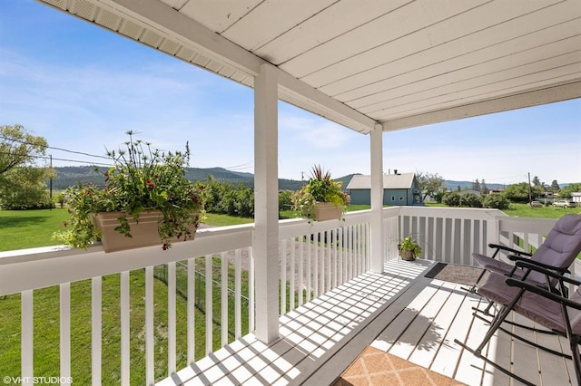 3265 US Highway 2 W, Kalispell, MT 59901 - deck with a mountain view and a yard