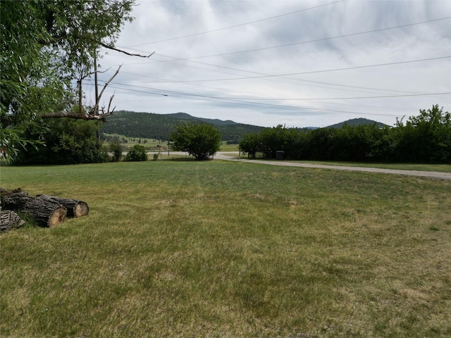 3265 US Highway 2 W, Kalispell, MT 59901 - view of grassy yard featuring a mountain view