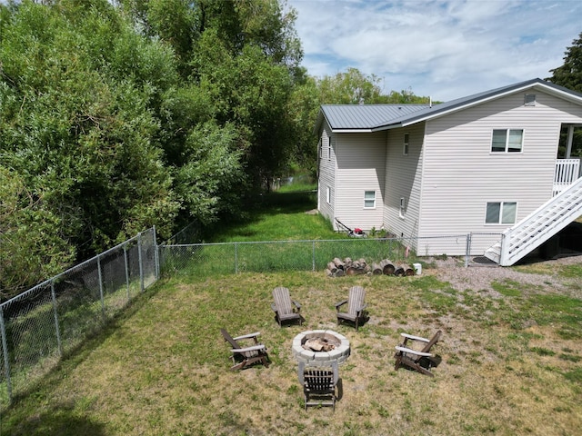 3265 US Highway 2 W, Kalispell, MT 59901 - fenced backyard with a fire pit and stairway