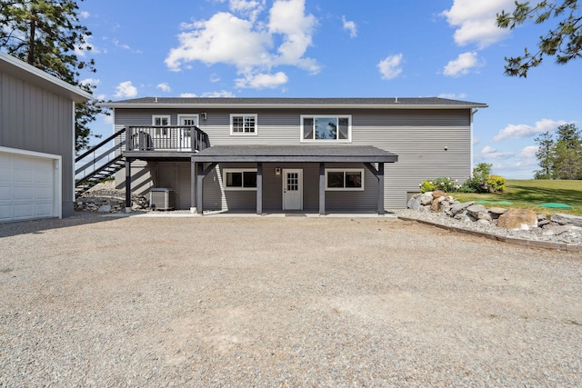 378 Last Best Pl, Kalispell, MT 59901 - view of front of house featuring stairway and a wooden deck