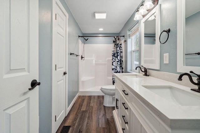 378 Last Best Pl, Kalispell, MT 59901 - full bathroom featuring wood finished floors, curtained shower, and double vanity