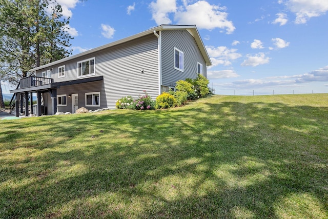 378 Last Best Pl, Kalispell, MT 59901 - view of side of home with stairway, a wooden deck, and a yard