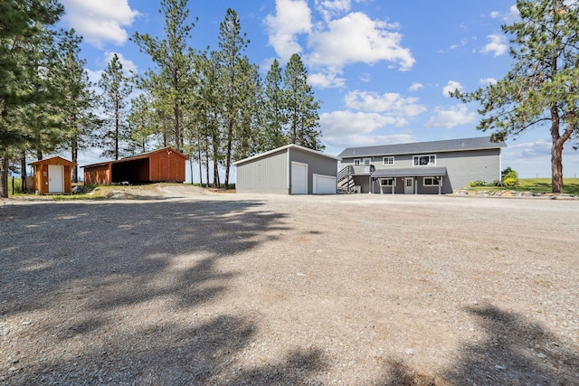 378 Last Best Pl, Kalispell, MT 59901 - view of front of property with a detached garage and an outbuilding