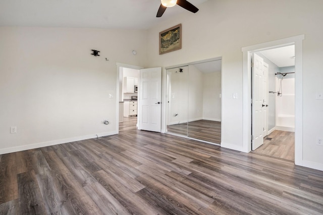 378 Last Best Pl, Kalispell, MT 59901 - unfurnished bedroom featuring wood finished floors, a closet, high vaulted ceiling, ensuite bathroom, and ceiling fan