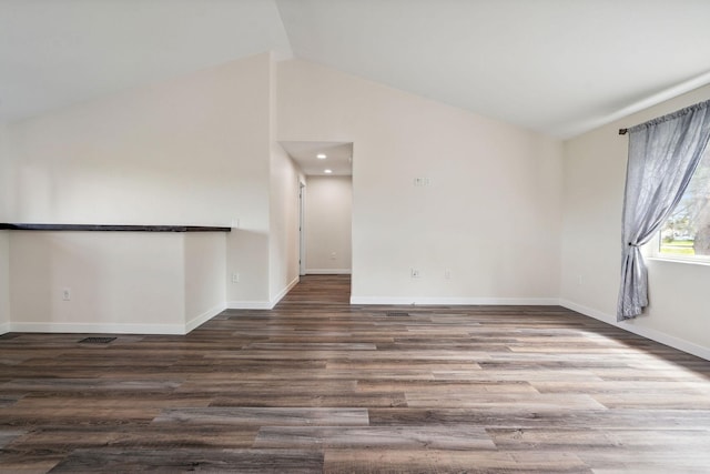 378 Last Best Pl, Kalispell, MT 59901 - empty room featuring vaulted ceiling and wood finished floors