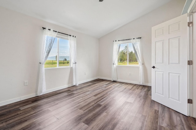 378 Last Best Pl, Kalispell, MT 59901 - spare room featuring vaulted ceiling and wood finished floors