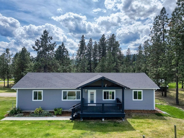 378 Last Best Pl, Kalispell, MT 59901 - single story home with a front yard, a deck, and roof with shingles
