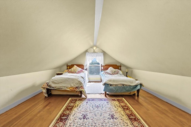 407 1st Ave W, Eureka, MT 59917 - bedroom featuring wood finished floors and vaulted ceiling