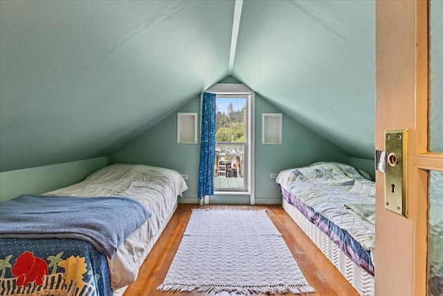 407 1st Ave W, Eureka, MT 59917 - bedroom with wood finished floors and vaulted ceiling