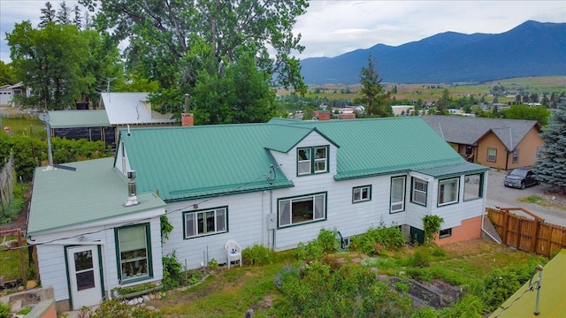 407 1st Ave W, Eureka, MT 59917 - back of property featuring a mountain view and a chimney