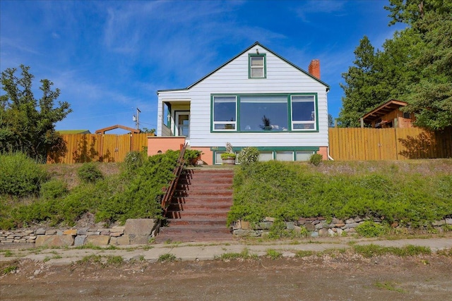 407 1st Ave W, Eureka, MT 59917 - bungalow-style house with a chimney and stairway