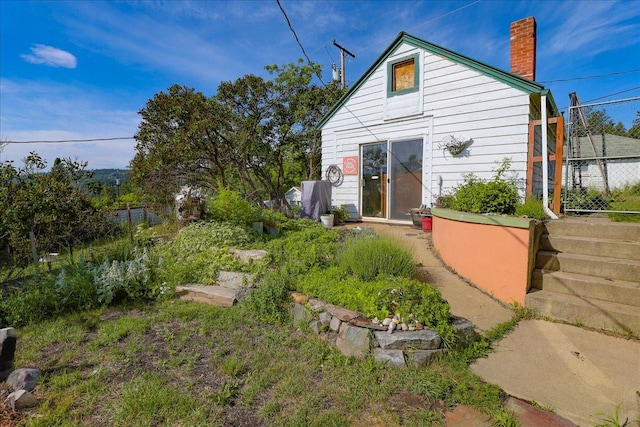 407 1st Ave W, Eureka, MT 59917 - back of house featuring a chimney