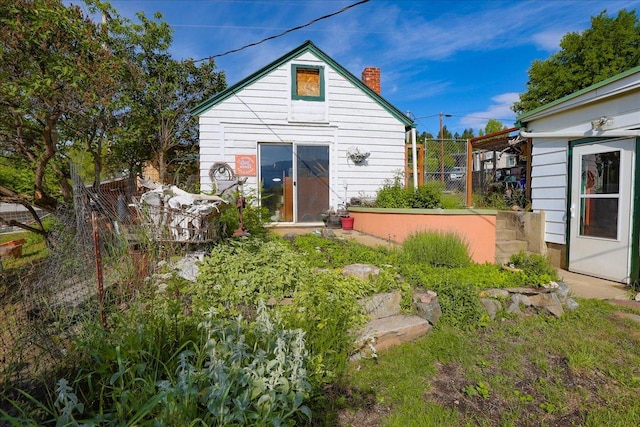 407 1st Ave W, Eureka, MT 59917 - rear view of house with a chimney