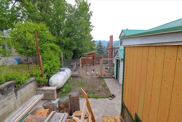 407 1st Ave W, Eureka, MT 59917 - view of yard with exterior structure, a mountain view, and an outdoor structure