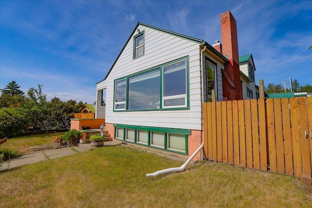 407 1st Ave W, Eureka, MT 59917 - view of side of home with a chimney
