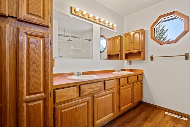14470 Harpers Bridge Rd, Missoula, MT 59808 - full bath featuring a shower, double vanity, and wood finished floors