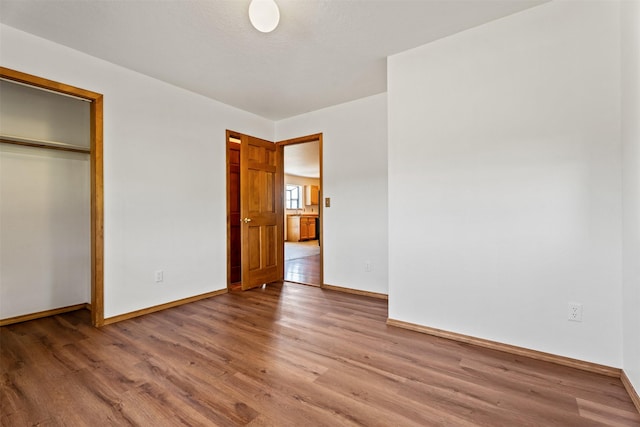 14470 Harpers Bridge Rd, Missoula, MT 59808 - unfurnished bedroom with wood finished floors and a closet