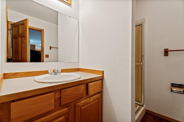 14470 Harpers Bridge Rd, Missoula, MT 59808 - bathroom featuring vanity, a shower with door, and wood finished floors