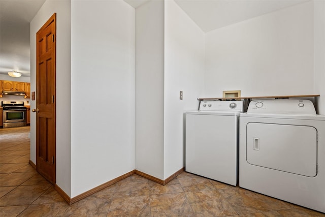 14470 Harpers Bridge Rd, Missoula, MT 59808 - washroom with separate washer and dryer and light stone finish flooring