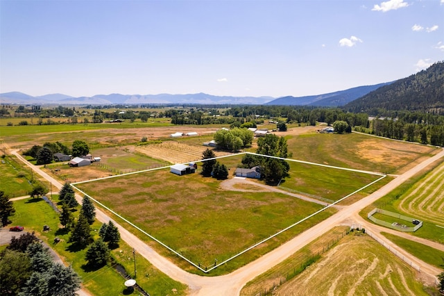 14470 Harpers Bridge Rd, Missoula, MT 59808 - aerial view of sparsely populated area with a mountain backdrop and property boundaries highlighted