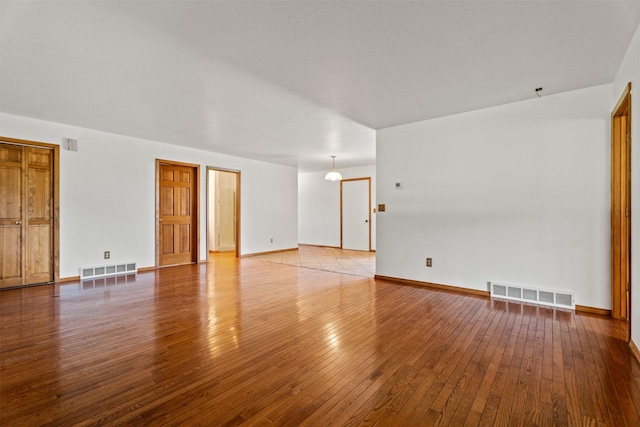 14470 Harpers Bridge Rd, Missoula, MT 59808 - unfurnished room featuring wood-type flooring and baseboards