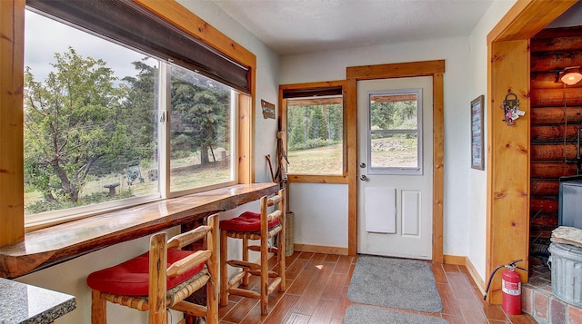 18998 Oris Ln, Florence, MT 59833 - dining area with wood finished floors and log walls