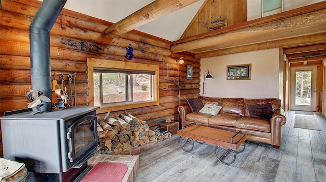 18998 Oris Ln, Florence, MT 59833 - living area featuring a wood stove, hardwood / wood-style floors, and log walls