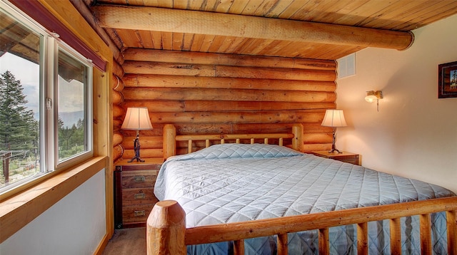 18998 Oris Ln, Florence, MT 59833 - bedroom featuring log walls and a wood ceiling with exposed beams