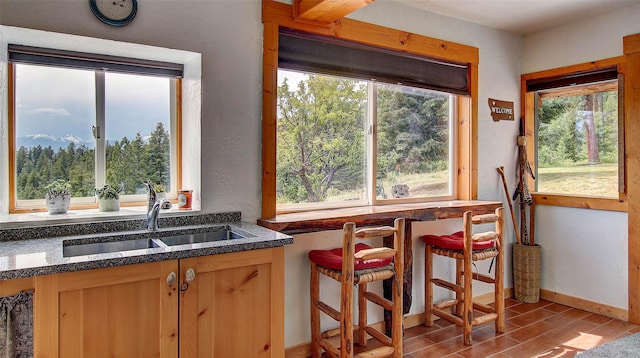 18998 Oris Ln, Florence, MT 59833 - kitchen with wood tiled floors and dark stone counters