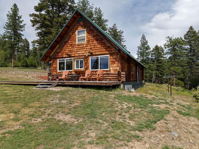 18998 Oris Ln, Florence, MT 59833 - rear view of property featuring a deck and a lawn
