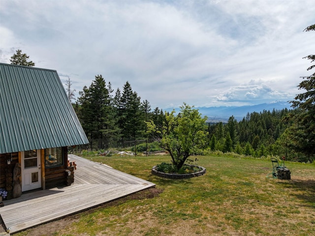 18998 Oris Ln, Florence, MT 59833 - view of green lawn with a wooden deck