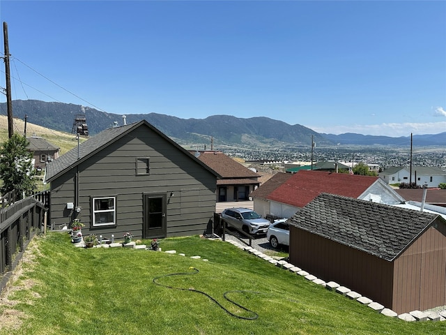 34 E Summit St, Butte, MT 59701 - back of house featuring a mountain view and an outbuilding