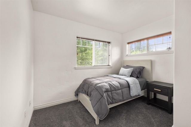 443 Karrow Ave, Whitefish, MT 59937 - bedroom with dark colored carpet and baseboards