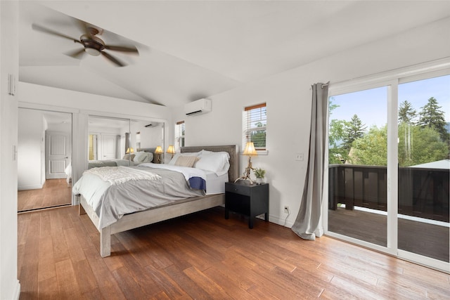 443 Karrow Ave, Whitefish, MT 59937 - bedroom featuring an AC wall unit, access to outside, wood finished floors, lofted ceiling, and a ceiling fan