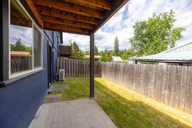 443 Karrow Ave, Whitefish, MT 59937 - fenced backyard with a patio area