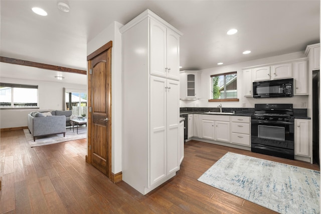 443 Karrow Ave, Whitefish, MT 59937 - kitchen with black appliances, dark countertops, dark wood-style flooring, white cabinets, and recessed lighting