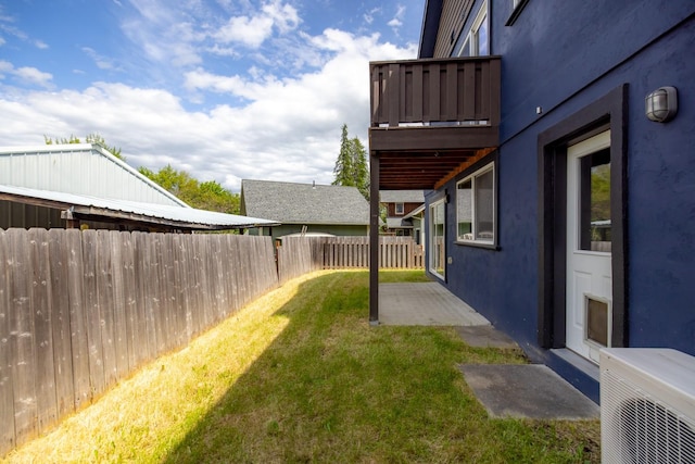 443 Karrow Ave, Whitefish, MT 59937 - fenced backyard with a balcony and a patio